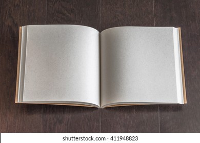 Blank square-size book mock up, catalog, magazine, brochure, open note page template recycle brown paper texture, dark wood table