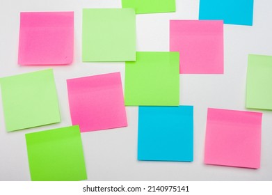 Blank Sticker Notes On White Background. Mockup Sticky Note Paper. Empty Sheets For Notes On White Bulletin Board. Discussing Business, Teamwork, Brainstorming Concept