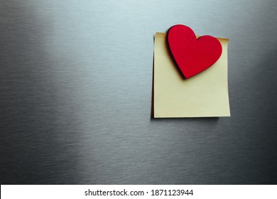 
Blank Sticker On The Refrigerator With A Heart Magnet