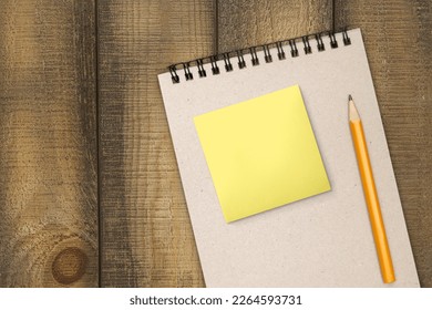Blank sticky notes on notebook and pen - Shutterstock ID 2264593731