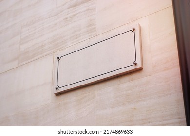 Blank Street Name Sign On A Stone White Facade. Old Town Street