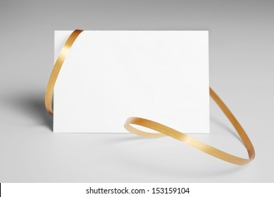 Blank thank you or greeting card with golden ribbon