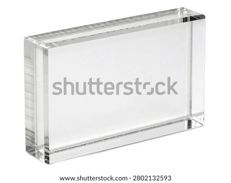 A blank, thick rectangular acrylic display block or clear lucite photo frame template, as seen in ultra-realistic-photo---blank-acrylic-periodic-tab.jpg. This transparent glass-like commercial mockup is presented from an angled perspective, isolated on a white transparent background.