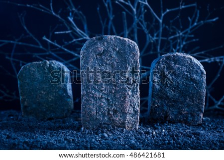 blank tombstone in the dark night at graveyard, halloween background
