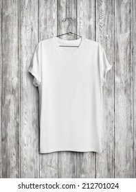 Blank T-shirt On Wood Wall