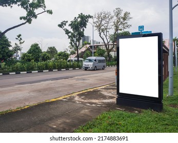 Blank Vertical Advertisement Mock Up At The Bus Stop, In A Residential Neighbourhood