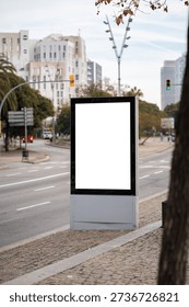 Blank vertical digital screen display mockup in city street, offering advertising space for promotion, marketing, and commercial branding outdoors