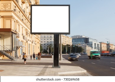 Blank vertical street billboard or big board with city background. 
