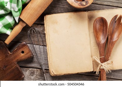 Blank vintage recipe cooking book and utensils. Top view with copy space - Shutterstock ID 504504346