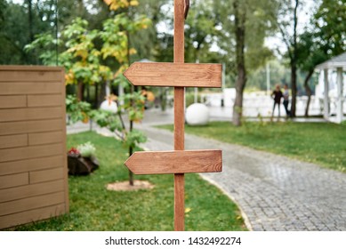 Blank Vintage Wedding Signs In Garden, Copy Space. Empty Wood Arrows In Park, Free Space