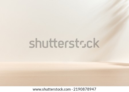 Blank warm lighting background. White and Wooden surface. Light and Shadow wallpaper. Space for text. Backdrop. Studio photography. 