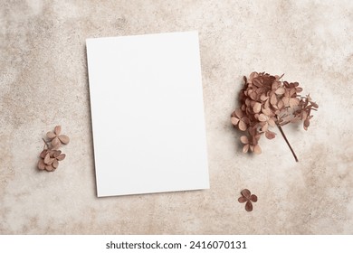 Blank wedding invitation card mockup with hydrangea flowers on beige background, copy space