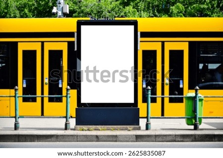 blank white ad panel. lightbox at tram stop. urban background. billboard for mockup sample image place holder. advertising background. glass aluminum structure. urban scene. yellow streetcar.