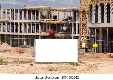 Blank White Advertising Banner On The Construction Cite Fence