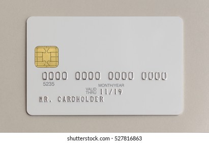 Blank White Bank Credit Card On Paper Background