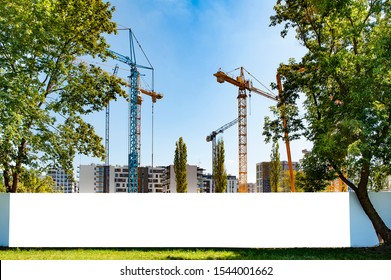 Blank white banner for advertisement on the fence of construction site - Shutterstock ID 1544001662