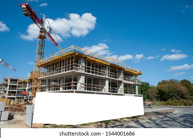 Blank White Banner For Advertisement On A Fence Of A Building Under Construction