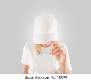 Blank white baseball cap mockup template, wear on women head, isolated, clipping path. Woman in clear hat and t shirt uniform mock up holding visor of caps. Cotton basebal cap mokcup on delivery guy.