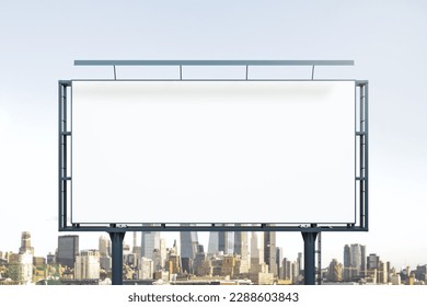 Blank white billboard on city buildings background at daytime, front view. Mockup, advertising concept - Shutterstock ID 2288603843