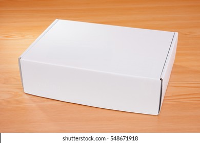 Blank White Box Mock Up On Wood Background