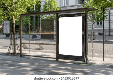 Blank White Bus Stop Vertical Billboard Mockup In Front Of An Empty Street. Outdoor Advertising Lightbox On The Sidewalk