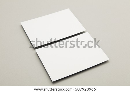 Blank white business card postcard flyer on a grey background