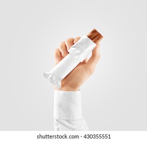 Blank White Candy Bar Plastic Wrap Opened Mockup Hold In Hand, Clipping Path. Clear Chocolate Packaging Template. Choco Factory Branding Candybar Package Mock Up. Sweet Pastry Shop Energy Bar Cover