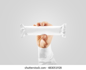 Blank White Candy Bar Plastic Wrap Mock Up Holding In Hand, Clipping Path. Clear Chocolate Bar Packaging Template. Choco Factory Logo Branding Candybar Package Mock Up. Pastry Shop Energy Bar Cover