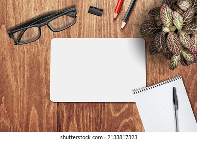 Blank White Card On Office Desk. Year Highlights Concept. Top View.