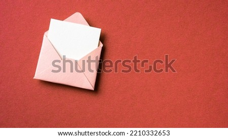 Blank white card with pink paper envelope template mock up on red background