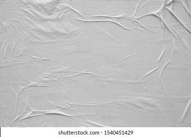 Blank white crumpled and creased paper poster texture background. Background for designers.
