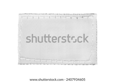Blank white fabric clothes patch label isolated over white