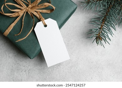 Blank white gift tag or label with christmas gift box, copy space, christmas or new year holidays decoration - Powered by Shutterstock