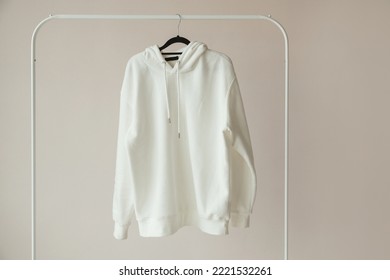 Blank White Hoodie, Sweatshirt Mock-up hanging on white Rack Hanger, front view - Shutterstock ID 2221532261