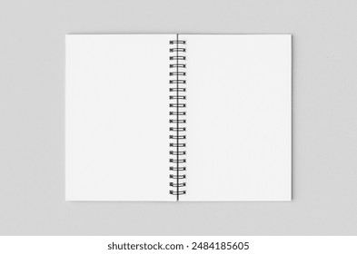 Blank white inside of a black spiral notebook mockup. - Powered by Shutterstock