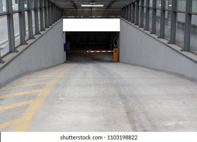 Blank White And Isolated Mockup Billboard Poster On The Wall Of Entrance To The Underground Garage