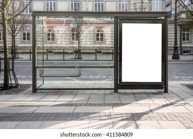 Blank white mockup of bus stop vertical billboard in front of empty street background