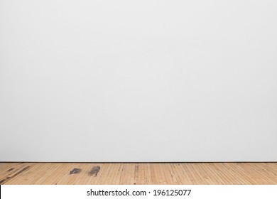 Blank White Museum Wall With Wooden Floor