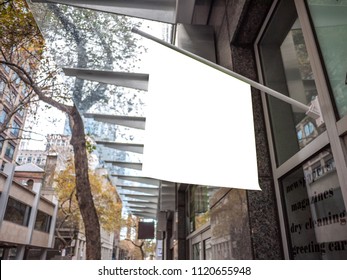 Blank White Outdoor Advertising Flag Mock Up Template. Background Texture Of Clear Mini Wall Flag Hanging Outside Convenience Store. 