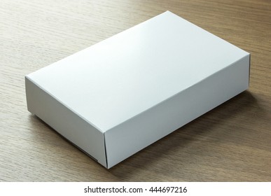 Blank White Paper Box On Dark Wood Background