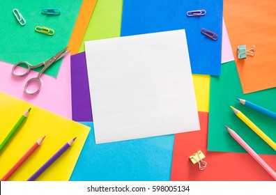 blank white paper on colorful paper background