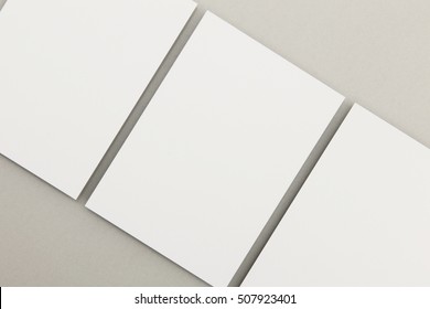 Blank white postcard flyer on a grey backgound