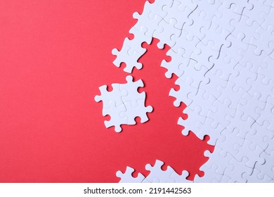 Blank White Puzzle Pieces On Red Background, Flat Lay