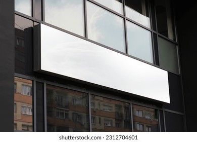 Blank white restaurant or shop sign mockup, large billboard banner on a storefront template.