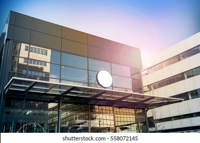 Blank White Round Signage Mockup, Modern Business Building. Circle Sign Board Mock Up Hanging On Glass Roof Of The Store Endrance. Street Advertising Banner Design Template.