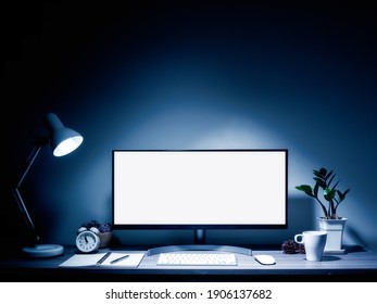 Blank White Screen Computer On The Table And Lamp In Dark Room At Night With Copy Space