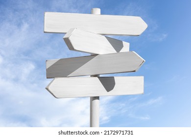 Blank white signpost with blue sky with white clouds background. Choose the correct way concept. Mock up, template - Powered by Shutterstock