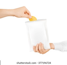 Blank White Snack Bag Mock Up Hold In Hand Isolated. Clear White Chips Pack Mockup. Eating Chips. People Treat Chips And Crisps. Men Taking Potato Chips From Opened Packaging. Friend Sharing Food.