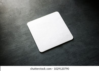 Blank white square beer coaster mockup lying on the textured background. Squared clear design mock up top view. Quadrate cup rug display, isolated. - Shutterstock ID 1029120790