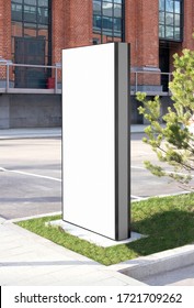 Blank White Vertical Pylon Stand Mockup Brick Building, Side View. Empty Information Stand On Street For Advertise Mock Up. Clear Vertical Monitor Or Totem For Affiche Or Ad Mokcup Template.